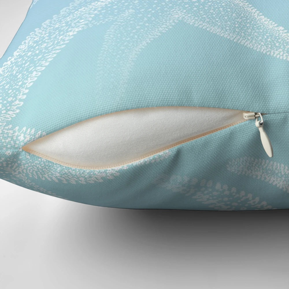Aqua blue beach-themed pillow with white starfish design