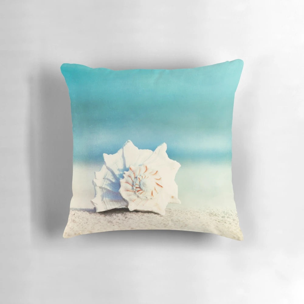 Aqua coastal decorative pillow with seashell design