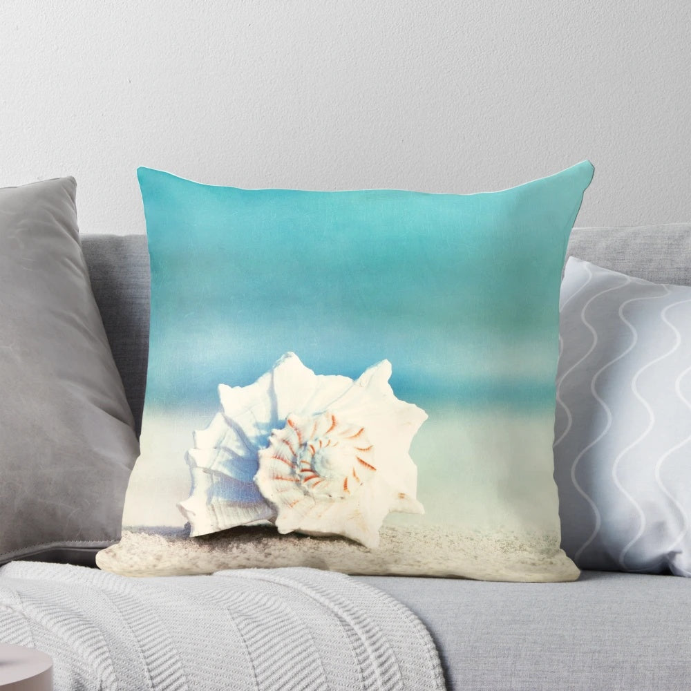 Aqua coastal decorative pillow with seashell design