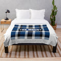 Argyle patterned plush blanket featuring artwork inspired by Mount Saint Mary's University