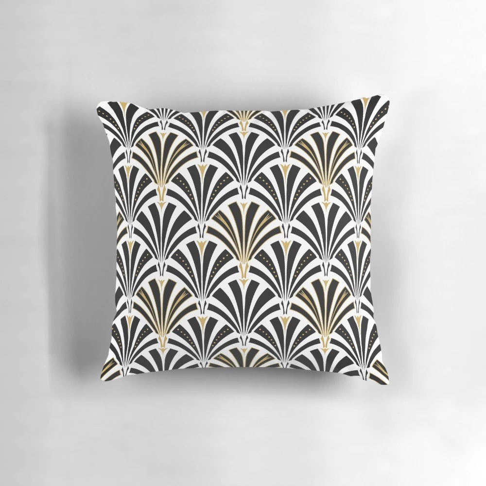 An art deco-inspired throw pillow with a classic fan pattern in black and white