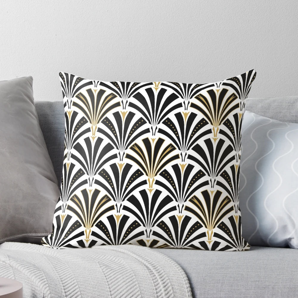An art deco-inspired throw pillow with a classic fan pattern in black and white