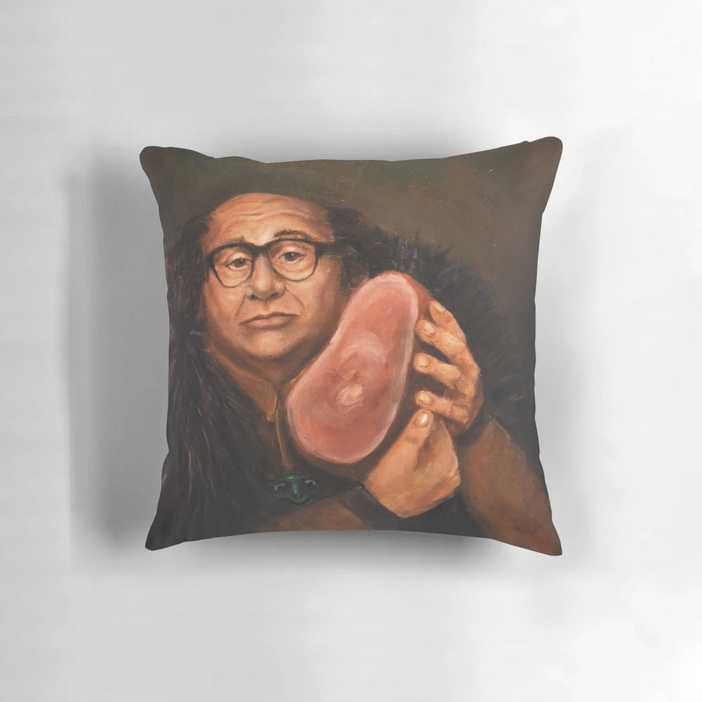 An artistic portrait of actor Danny Devito printed on a decorative throw pillow.