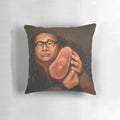 An artistic portrait of actor Danny Devito printed on a decorative throw pillow.