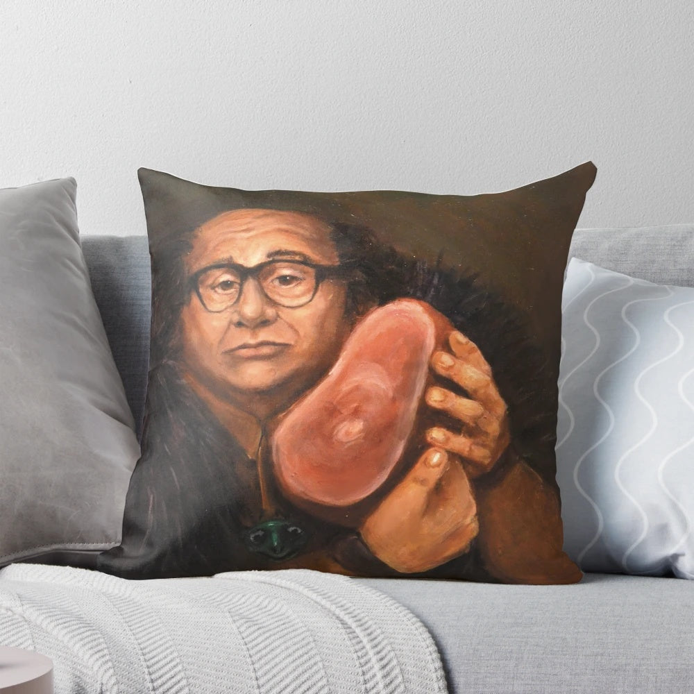 An artistic portrait of actor Danny Devito printed on a decorative throw pillow.