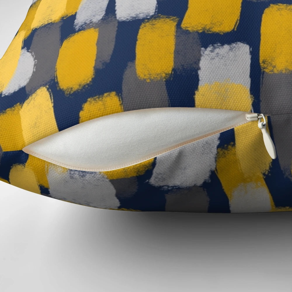 Navy blue decorative pillow with abstract grey and mustard yellow paint brush strokes