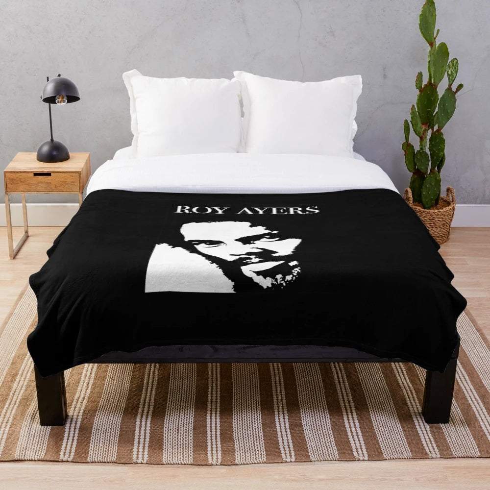 Plush blanket featuring an abstract, minimalist portrait of jazz musician Roy Ayers