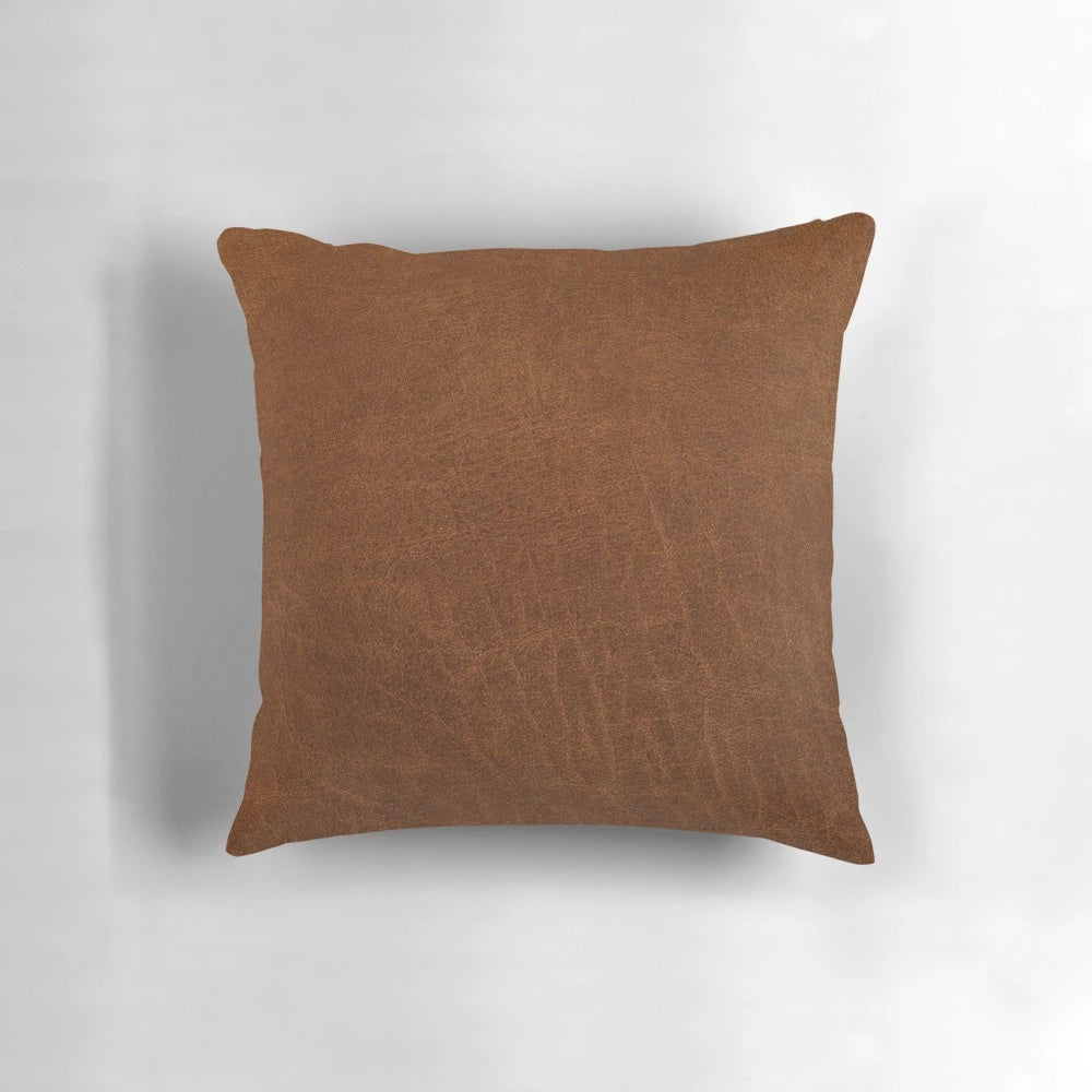 Artfully textured leather-inspired decorative pillow