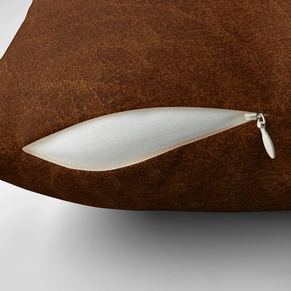 Artfully textured leather-inspired decorative pillow