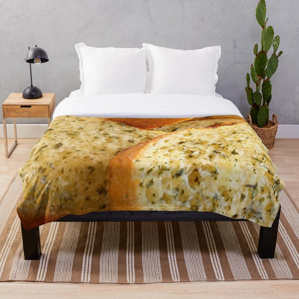 Soft, plush blanket featuring a whimsical garlic bread design