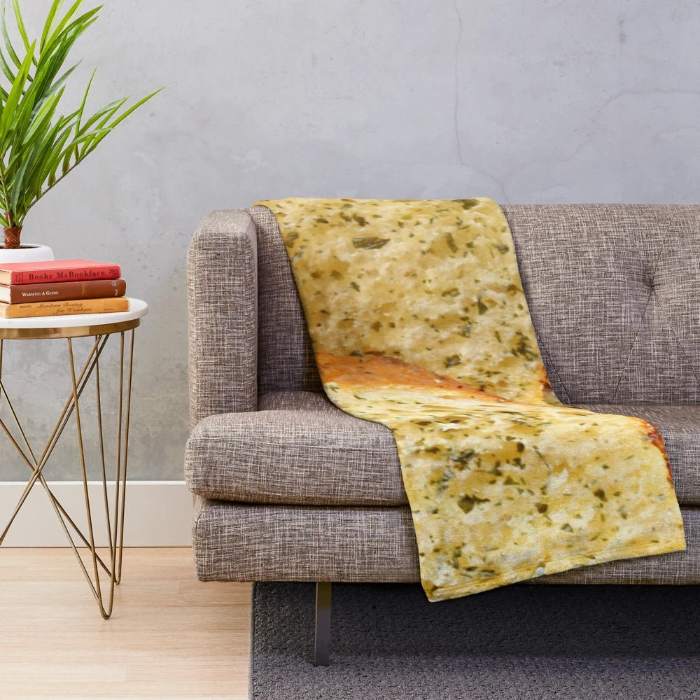 Soft, plush blanket featuring a whimsical garlic bread design