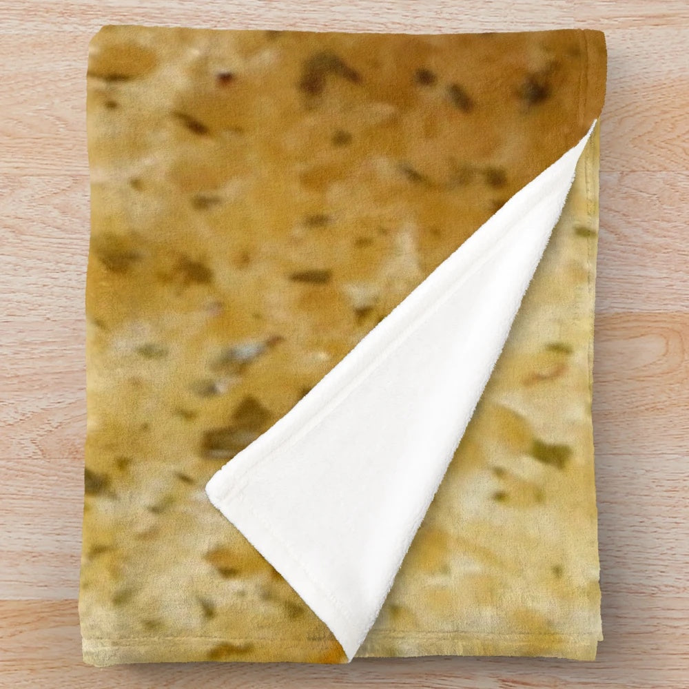 Soft, plush blanket featuring a whimsical garlic bread design