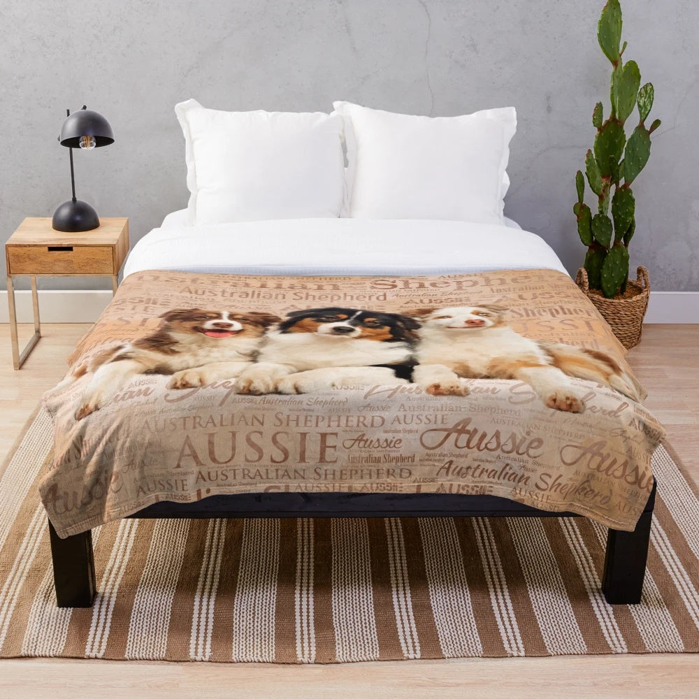 Artistic Australian Shepherd dog portrait on a plush blanket