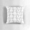 Black and white hand-drawn dachshund illustration on a decorative pillow