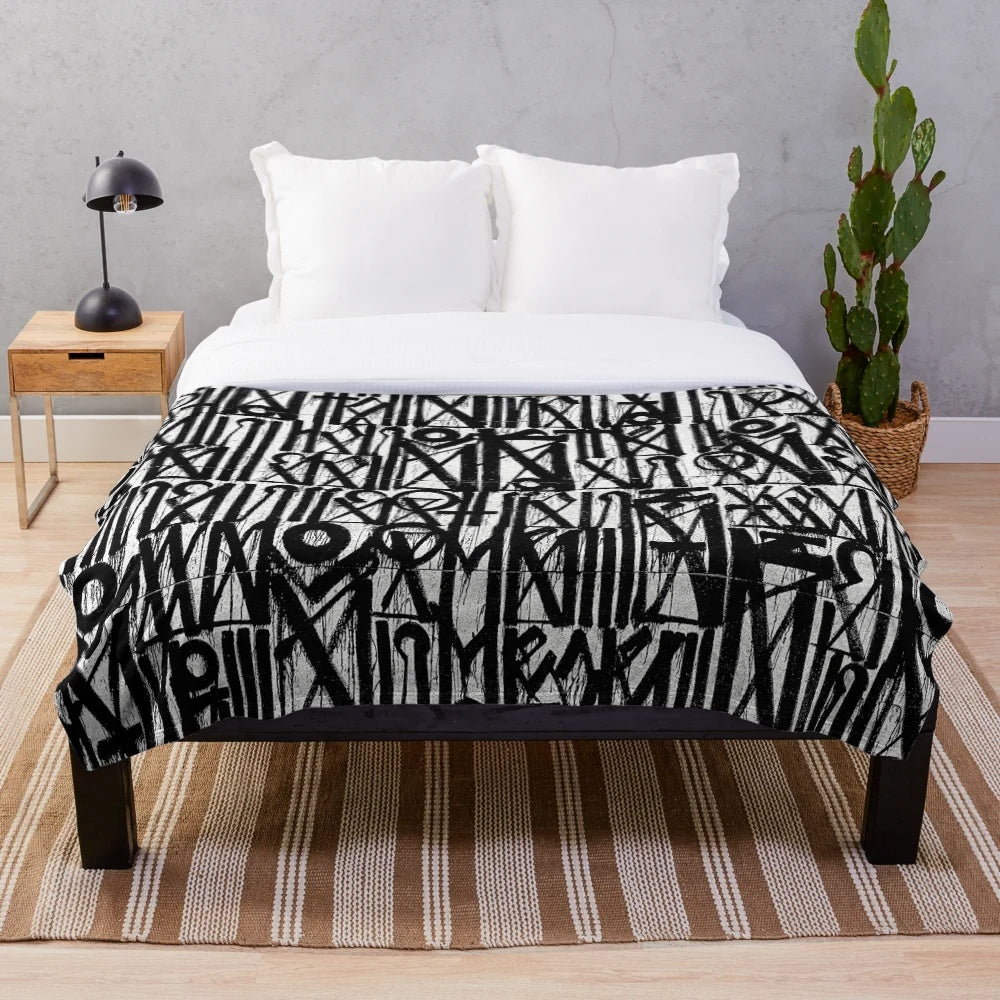 Graffiti-inspired abstract plush blanket in gray tones