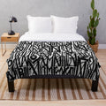 Graffiti-inspired abstract plush blanket in gray tones