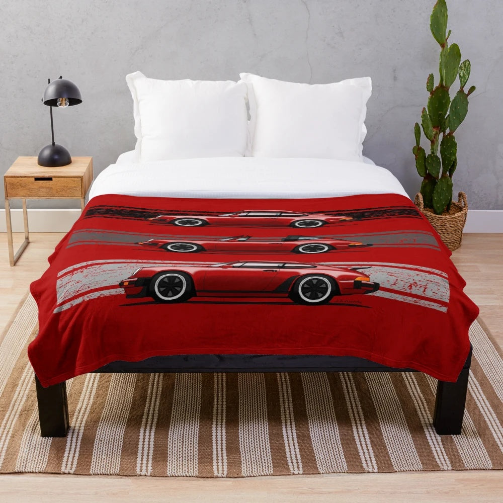 Plush blanket with artistic rendering of classic German sports cars