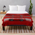 Plush blanket with artistic rendering of classic German sports cars