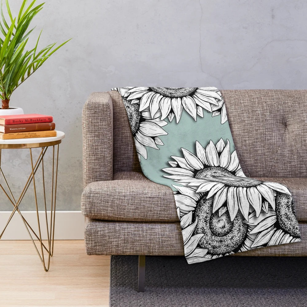 Plush blanket featuring a graphic design of wild flowers in black and white