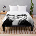 Plush blanket featuring a black and white linocut portrait of the iconic French actor Louis de Funès
