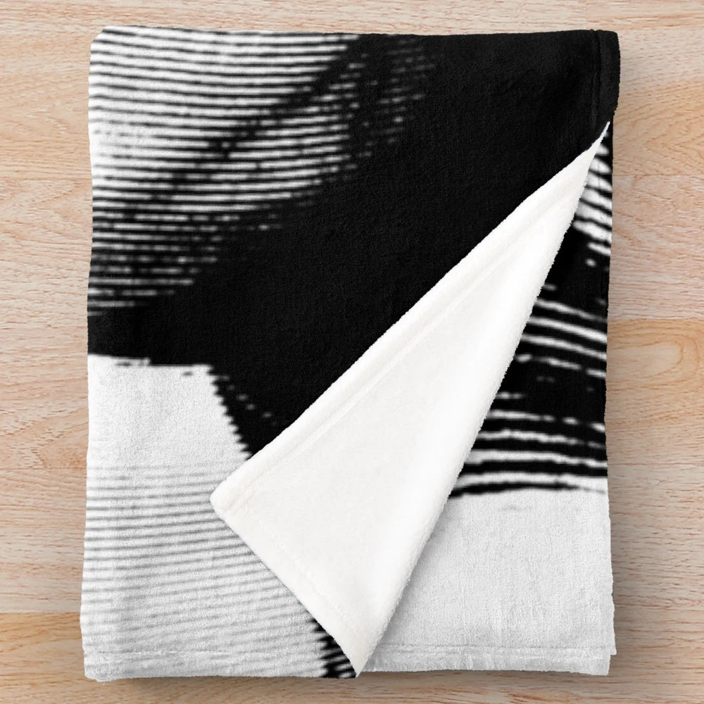 Plush blanket featuring a black and white linocut portrait of the iconic French actor Louis de Funès