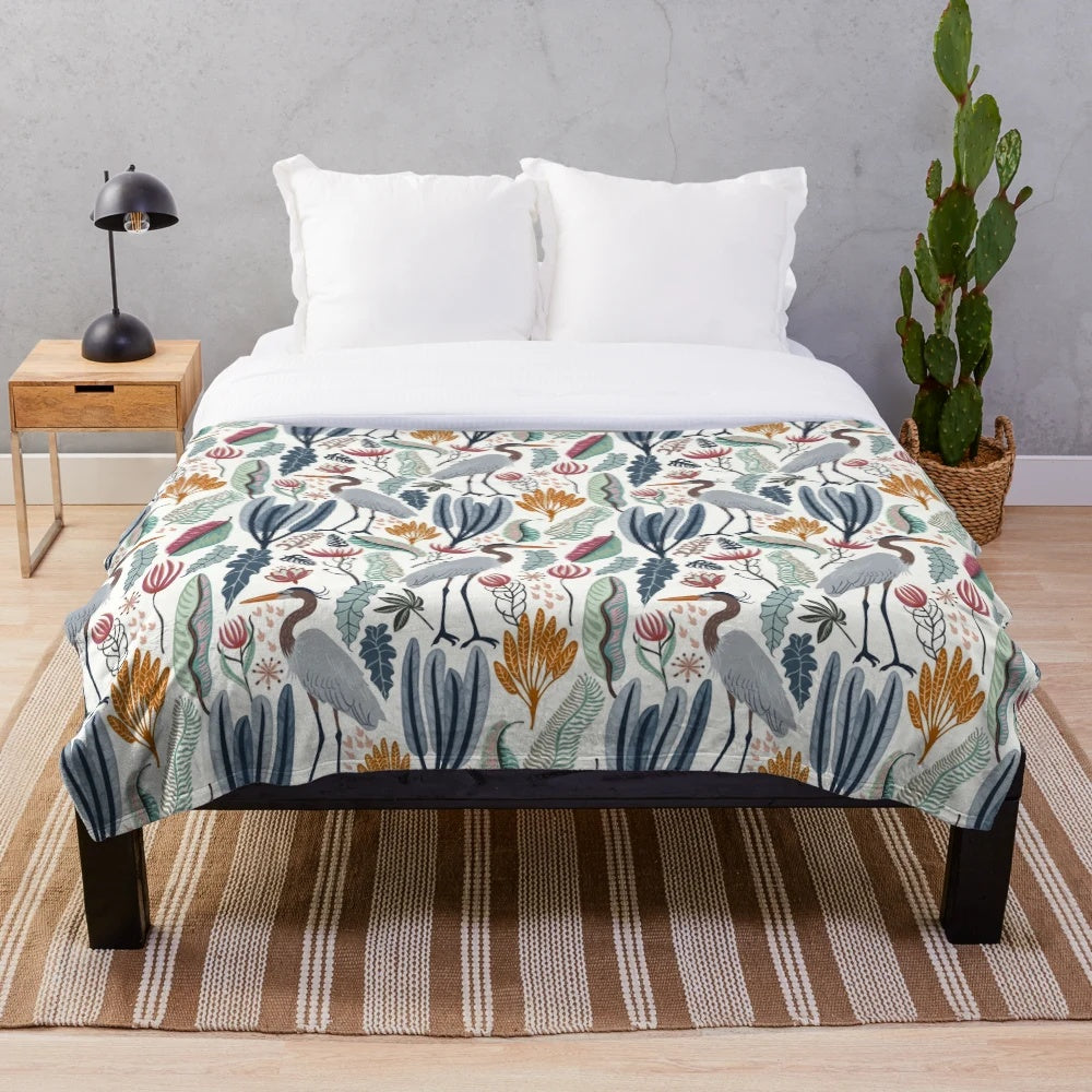 Plush blanket featuring a beautiful heron and nature-inspired design