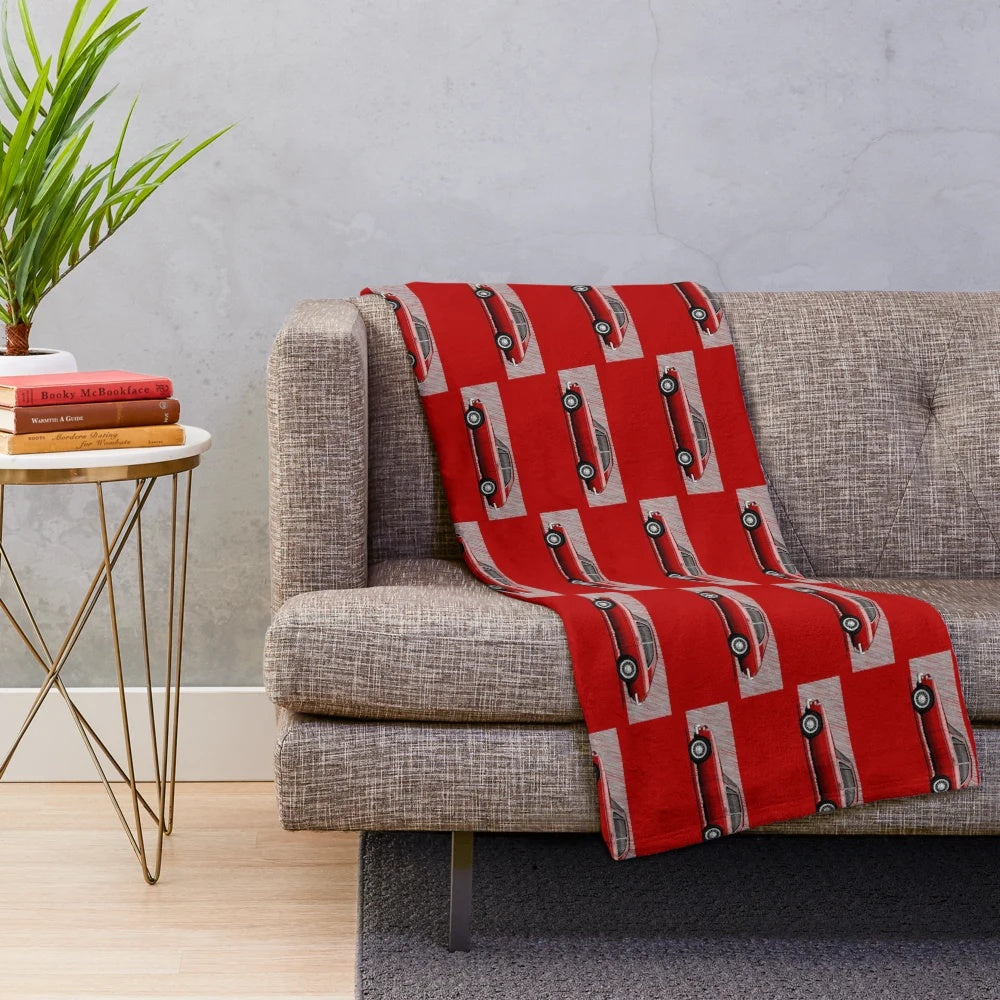 Plush blanket featuring an artistic illustration of the classic MGB GT sports coupe