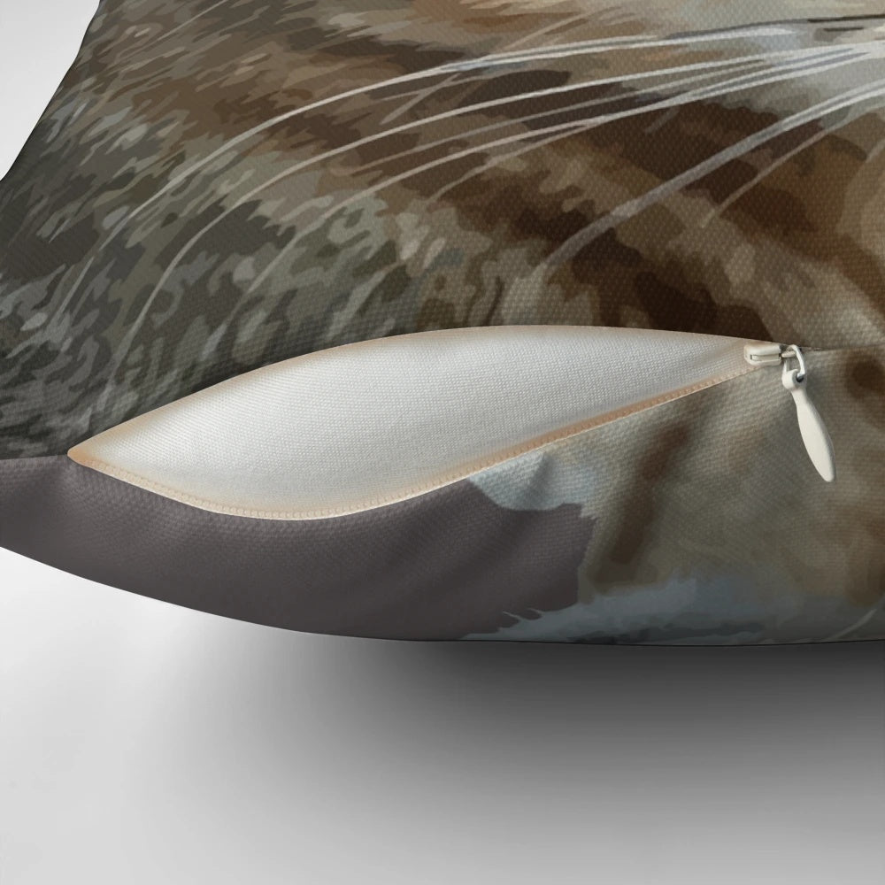 Closeup portrait of a tabby cat on a decorative throw pillow