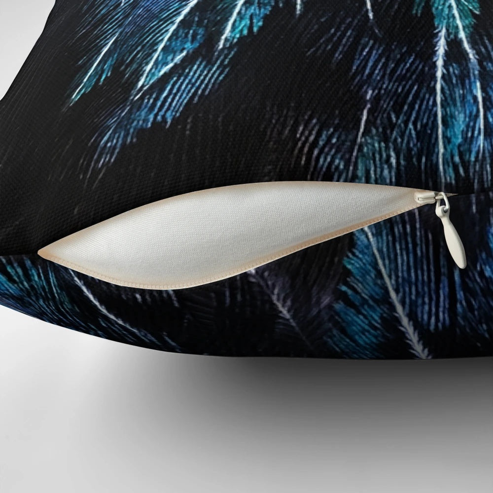 Close-up image of a vibrant tui feather, part of a handcrafted decorative pillow