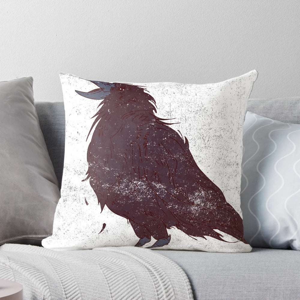 A stylishly distressed dark bird graphic throw pillow featuring original feather details.