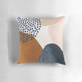 Artistic abstract pattern pillow in terracotta, navy blue, and blush pink colors