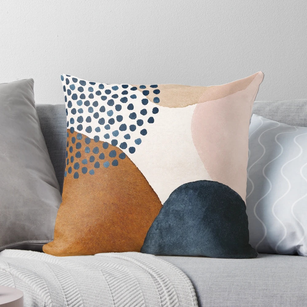 Artistic abstract pattern pillow in terracotta, navy blue, and blush pink colors
