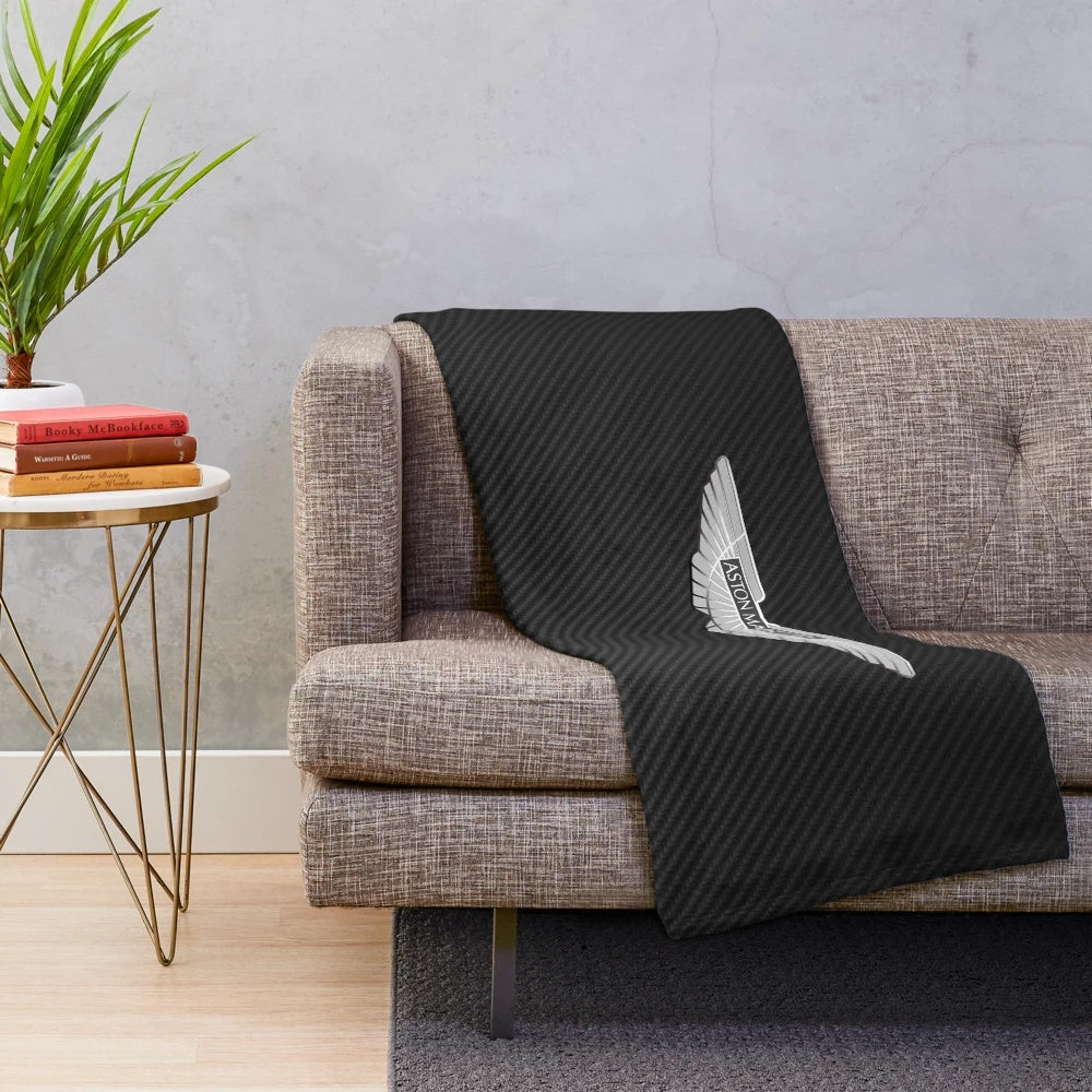Aston Martin-inspired plush blanket with carbon fiber background
