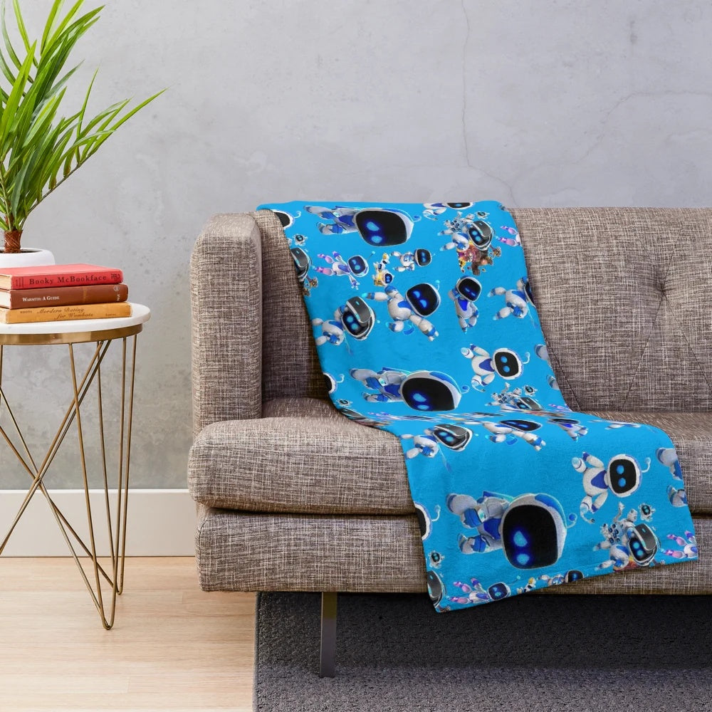 Astrobot-themed plush blanket featuring a cute robotic astronaut character