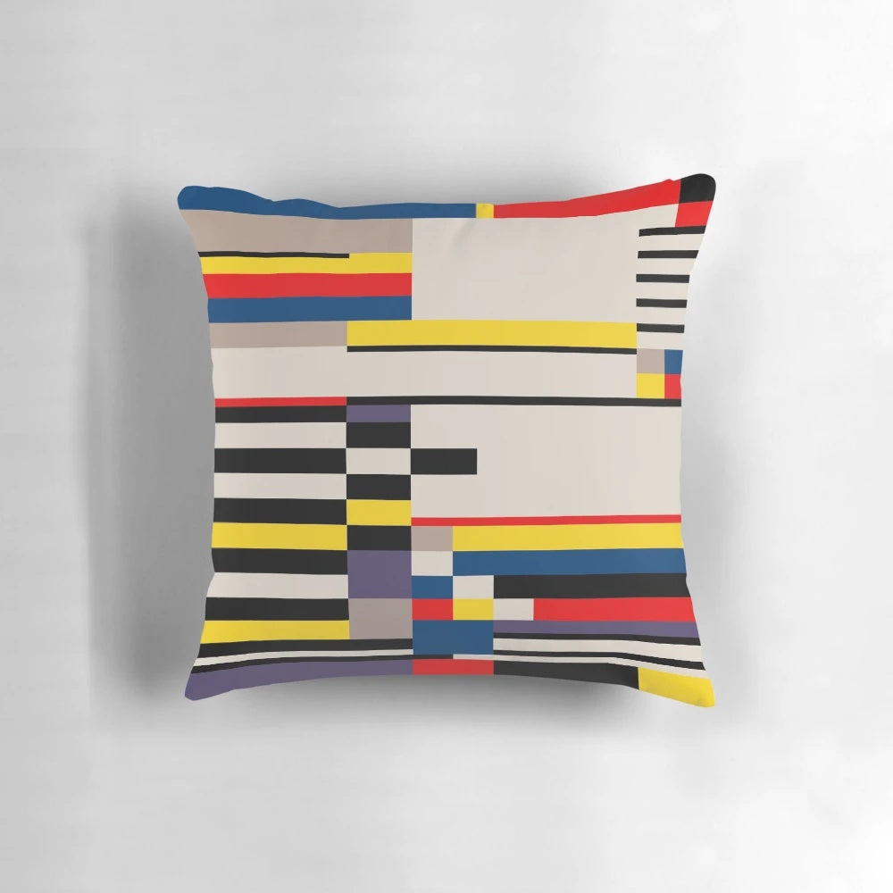 Vibrant abstract asymmetric design pillow featuring primary colors and a Bauhaus-inspired grid pattern