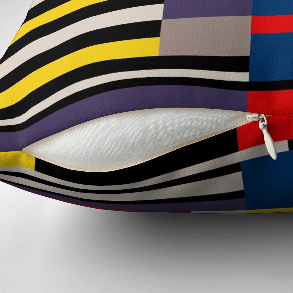Vibrant abstract asymmetric design pillow featuring primary colors and a Bauhaus-inspired grid pattern