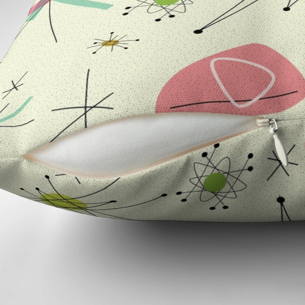Vibrant atomic-inspired 50s pillow featuring a pink and blue geometric pattern