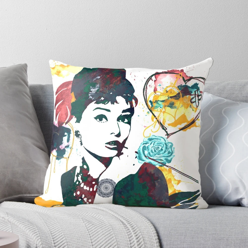 Decorative throw pillow featuring a nature-inspired color palette and Audrey Hepburn's iconic portrait