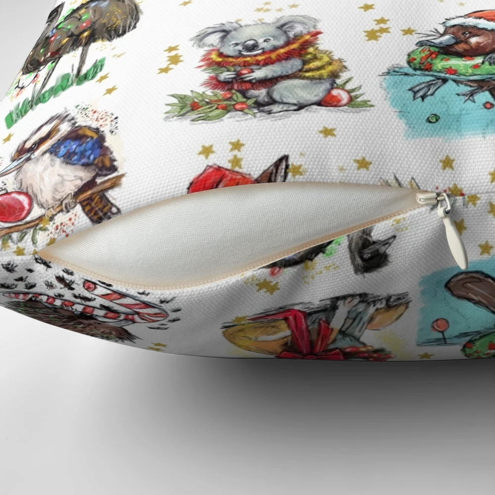 Aussie Bush Christmas Pillow featuring koalas, dingoes, and other native Australian animals, designed by Tracey Mackie