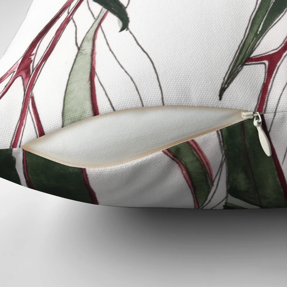 Vibrant pink and green eucalyptus flowering gum illustration on a decorative pillow.