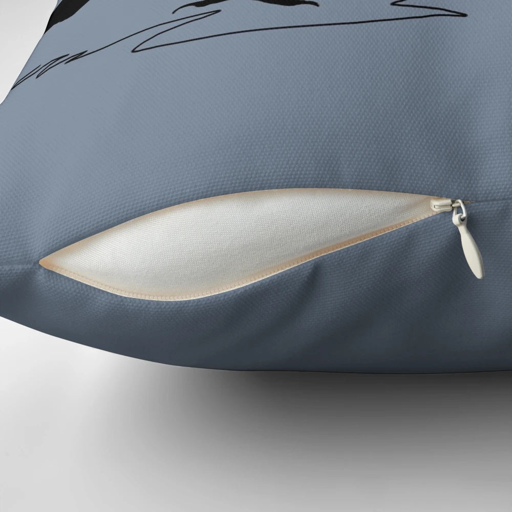Stylish black and white graphic art illustration of an Australian magpie on a decorative throw pillow.