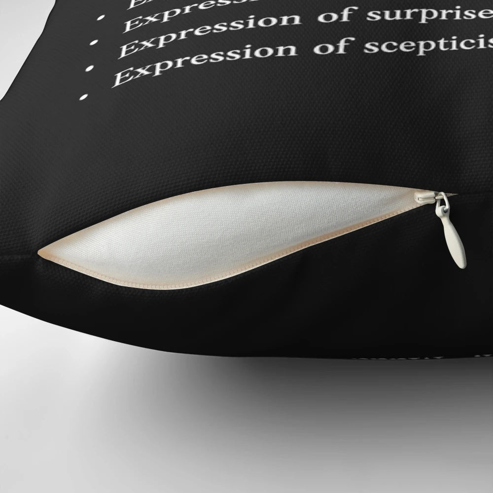 White on black pillow with the Australian slang term "mate" printed on it.