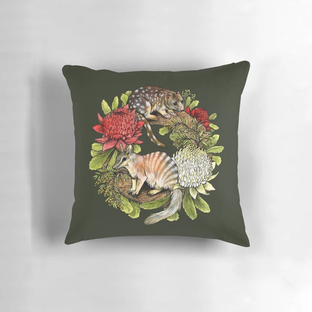 Decorative Christmas wreath pillow featuring Australian wildlife like the quoll and numbat.