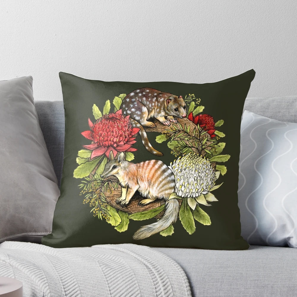 Decorative Christmas wreath pillow featuring Australian wildlife like the quoll and numbat.