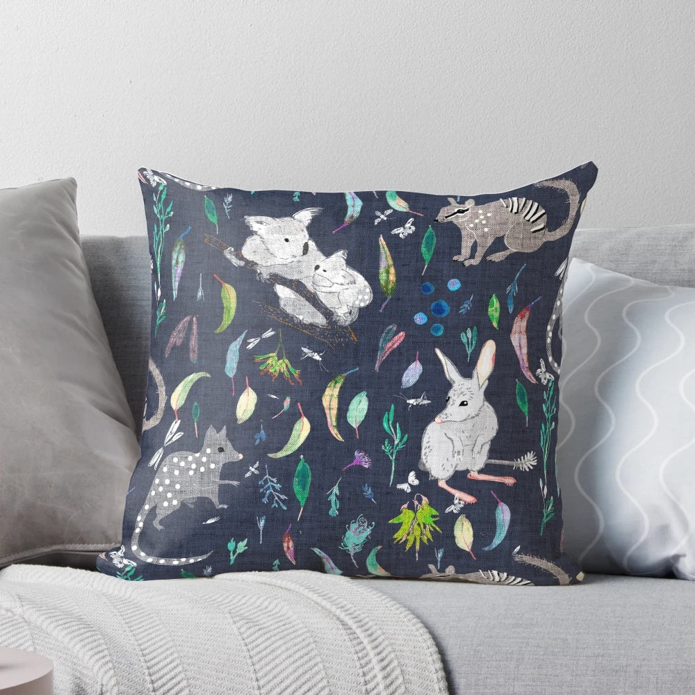 Australiana Marsupial Decorative Pillow featuring koalas, bilbies, and quolls on a navy background with gum leaves and nuts