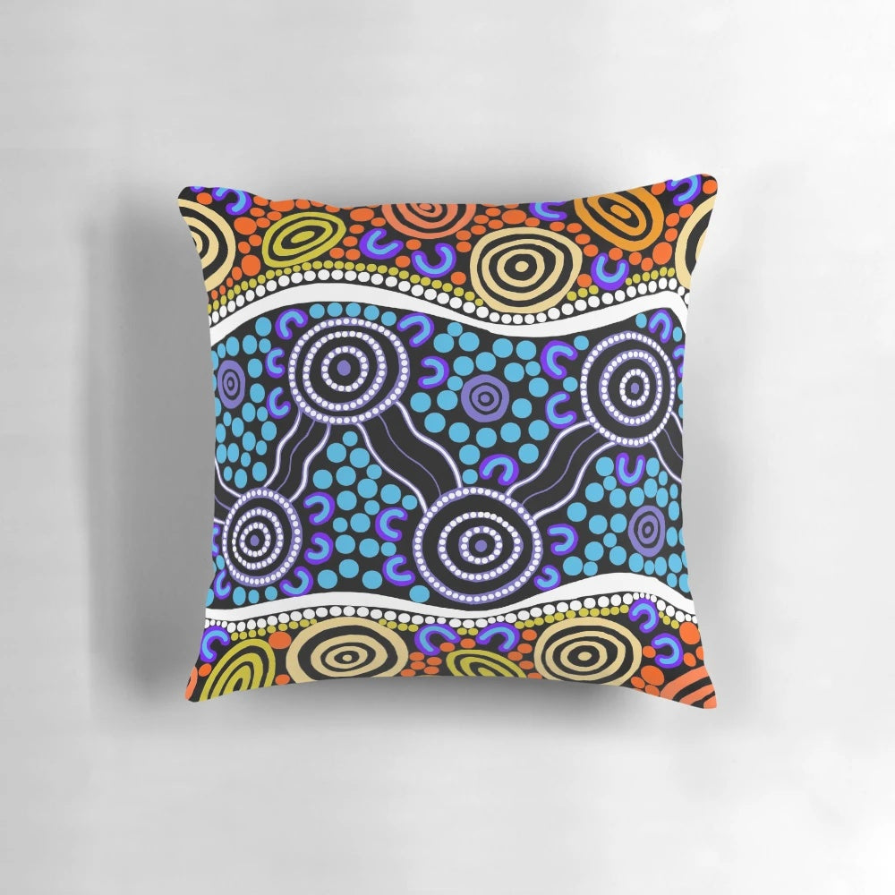 Authentic aboriginal art pillow featuring traditional dot patterns and native Australian animals like kangaroos and emus.
