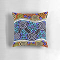 Authentic aboriginal art pillow featuring traditional dot patterns and native Australian animals like kangaroos and emus.
