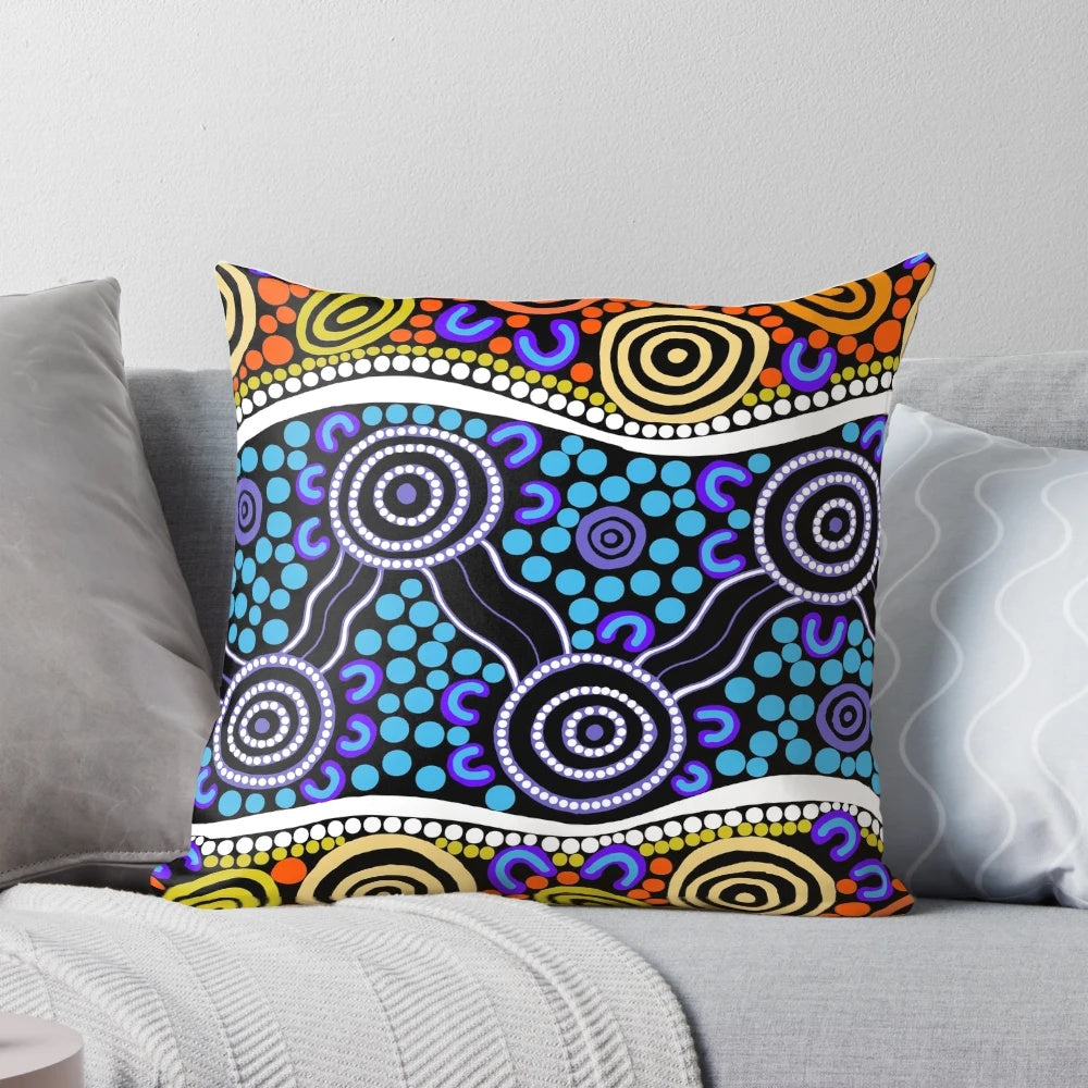 Authentic aboriginal art pillow featuring traditional dot patterns and native Australian animals like kangaroos and emus.