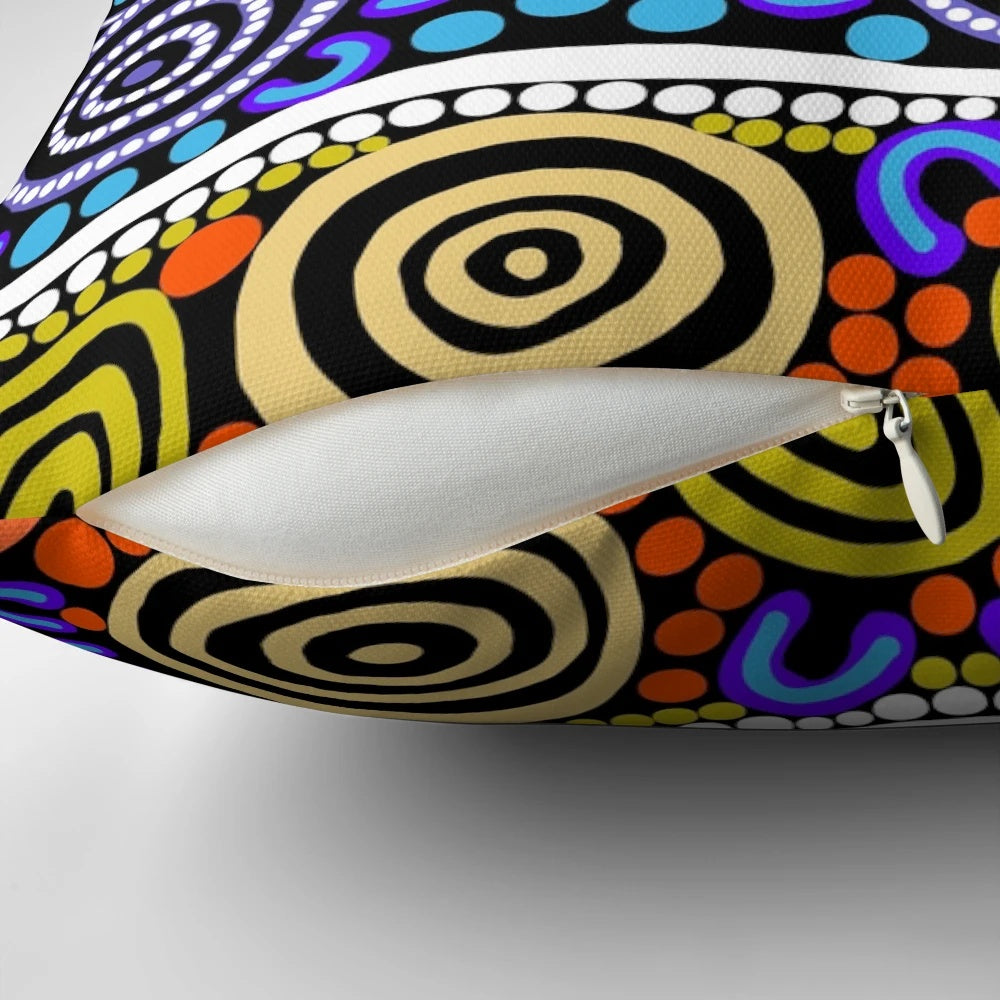 Authentic aboriginal art pillow featuring traditional dot patterns and native Australian animals like kangaroos and emus.