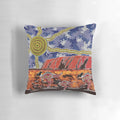 Pillow featuring vibrant aboriginal art design inspired by the iconic Uluru rock formation in the Australian outback.